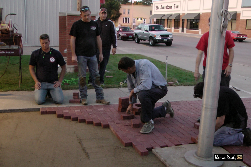 Jamestown Fire Dept install commemorative bricks at firefighter statue Sept 24, 2014